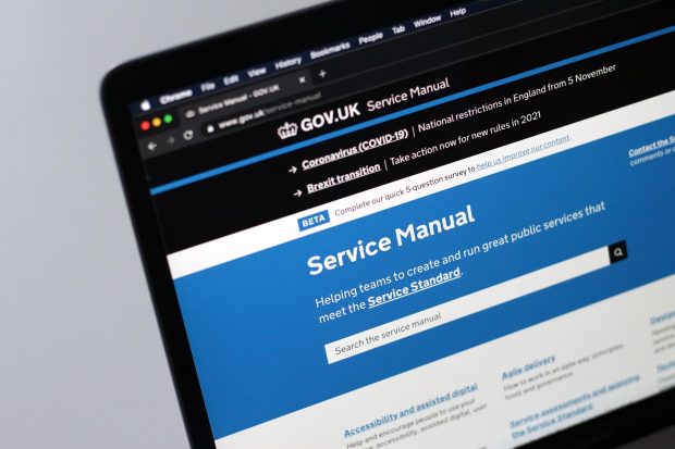 Close-up of a laptop screen showing the website of the GOV.UK Service Manual stating its purpose: Helping teams to create and run great public services that meet the Service Standard.